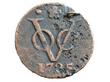 Das Symbol der VOC auf einer alten Münze